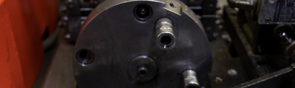 close up of end forming machine at Wooley Manufacturing